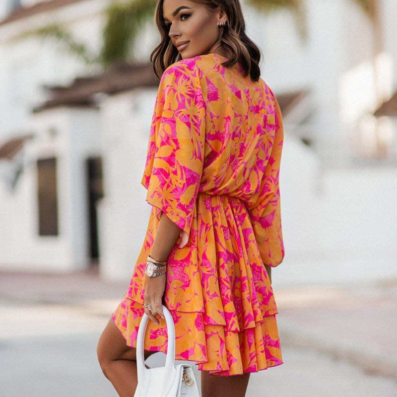 Women’s Floral Wrap Mini Dress with Ruffle Hem and Flowing Sleeves